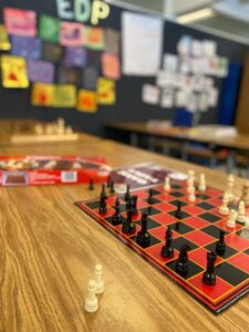 A chessboard setup for student to play in the Extended Day Program space.