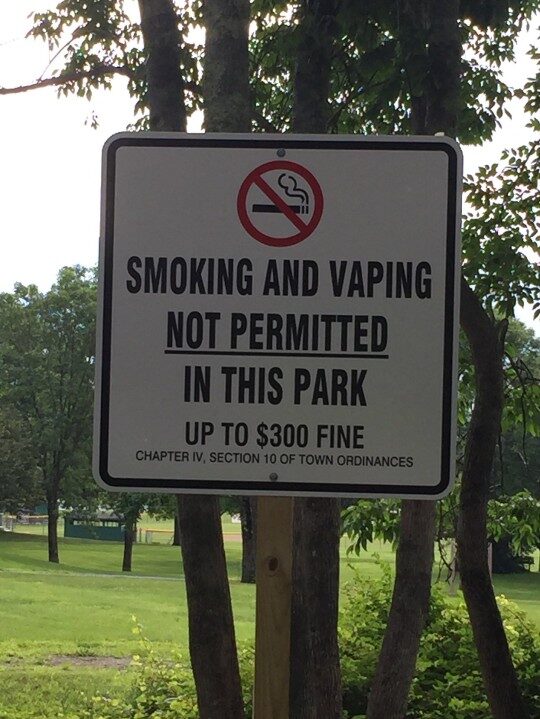 A sign forbidding smoking and vaping at a local park.