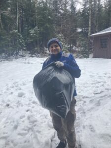 RTU participant holding a bag of trash
